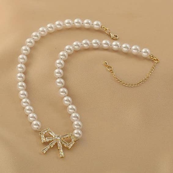 Gold Ladies Lux Fake Pearl Bowknot Necklace SKAJ015 for wholesale on Faire0