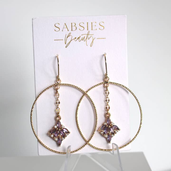 Shiny Gold Hoop with Purple Crystal for wholesale by Sabsies Beauty