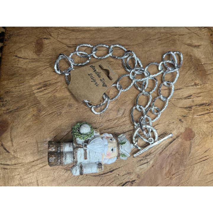 Sandra Ling Designs – wholesale Pendant/charm necklace – ❄️ Frosted Nutcracker Necklace – “Marching Through a Winter 1