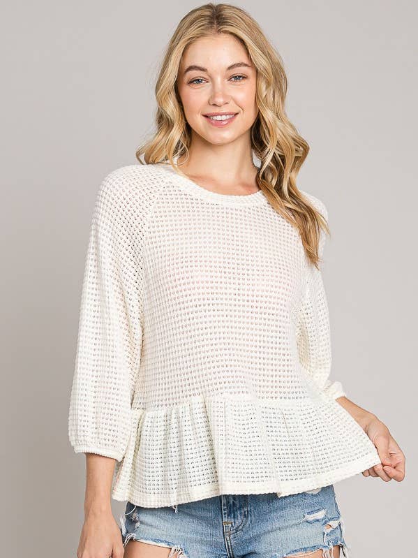 Top in maglia peplo con lunghezza a bracciale per la vendita all'ingrosso da parte di Cerule