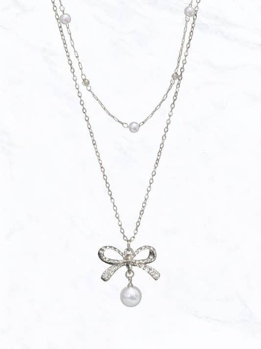 Collana con pendente Pearl Bow per la vendita all'ingrosso da parte di Suzie Q USA