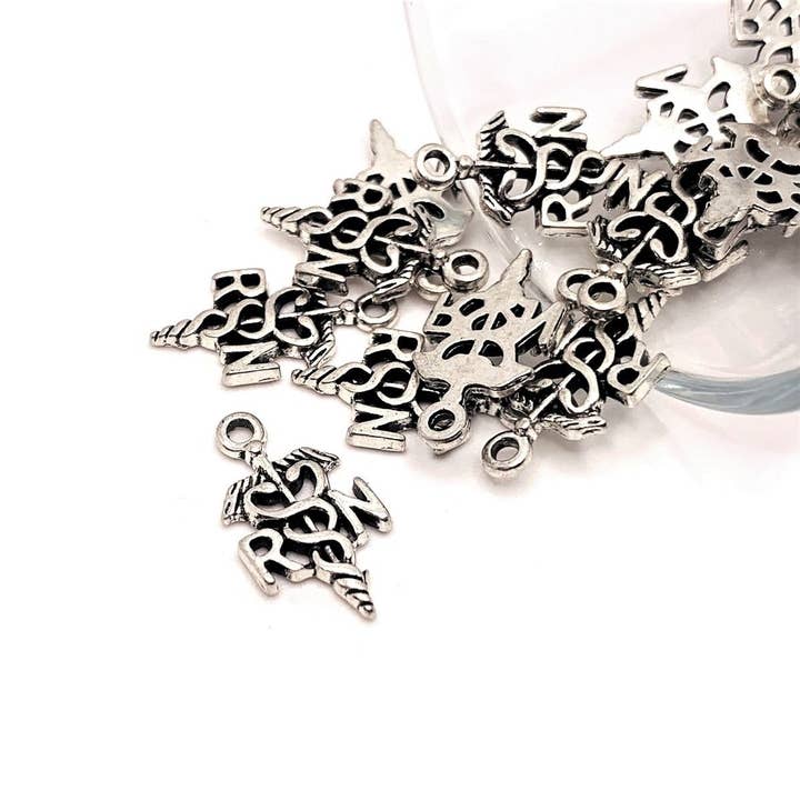 Silver RN with Caduceus Charms, 20x11mm for wholesale by Guerrilla Charm