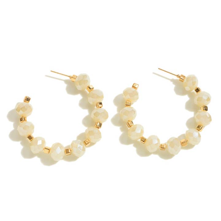 Boucle d'oreille en forme de créole en ivoire pour la vente par Luke and Park