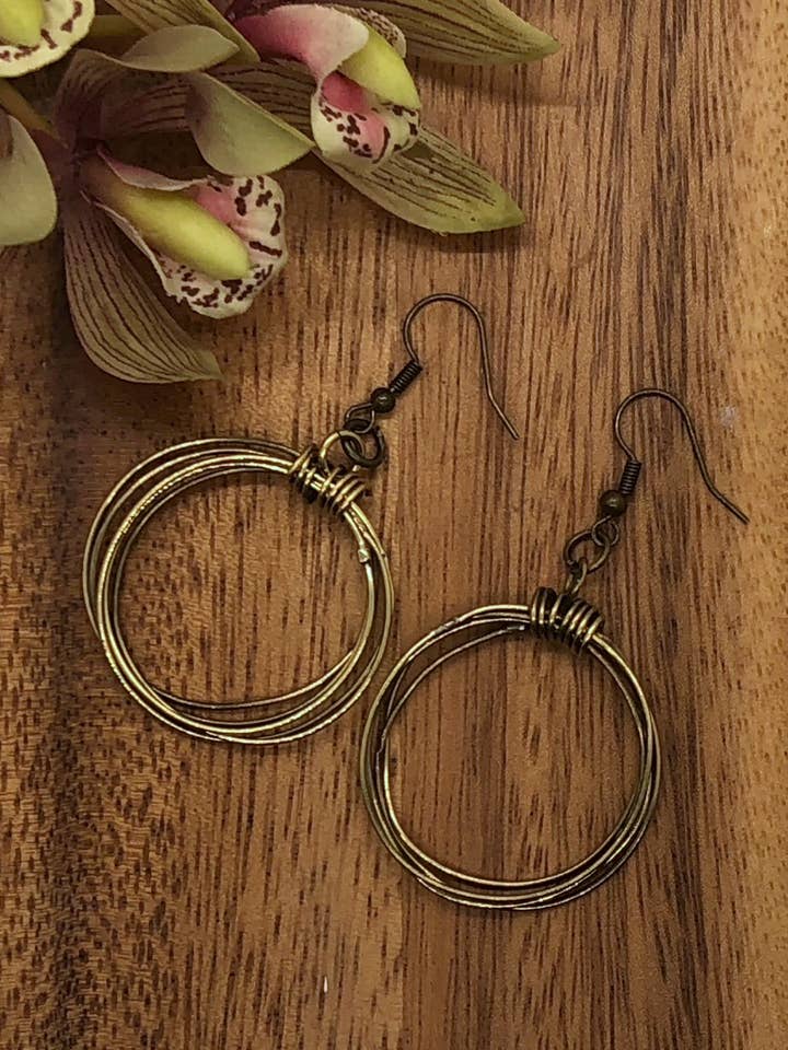 Nested Hammered Brass Hoop Earrings for wholesale by Commonality Cooperative