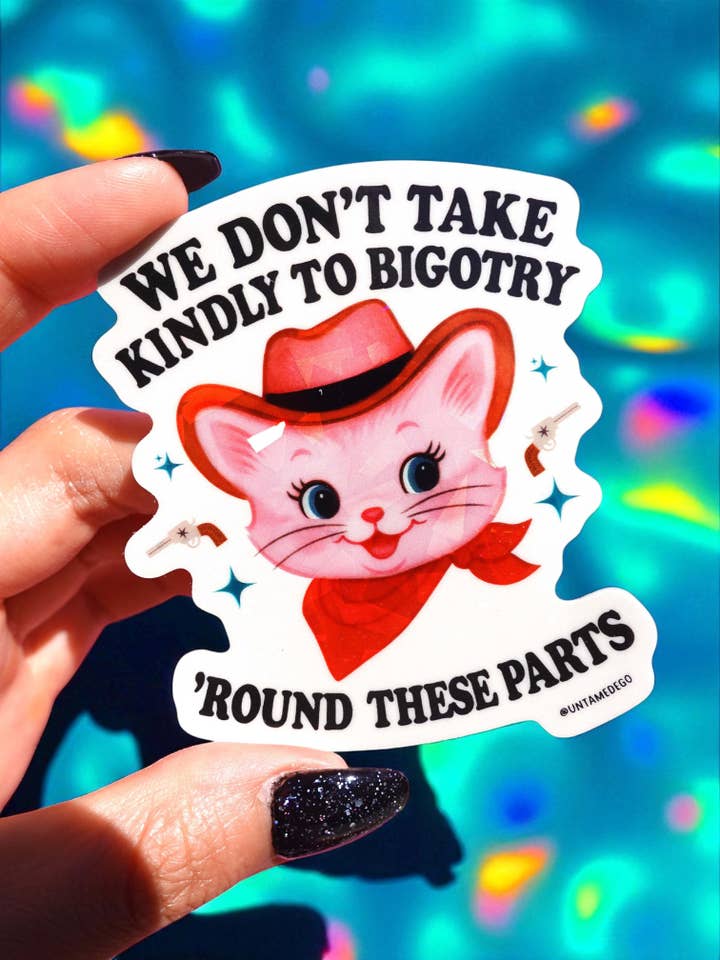 We Don’t Take Kindly to Bigotry – Cowboy Cat Vinyl Sticker for wholesale by Untamedego LLC