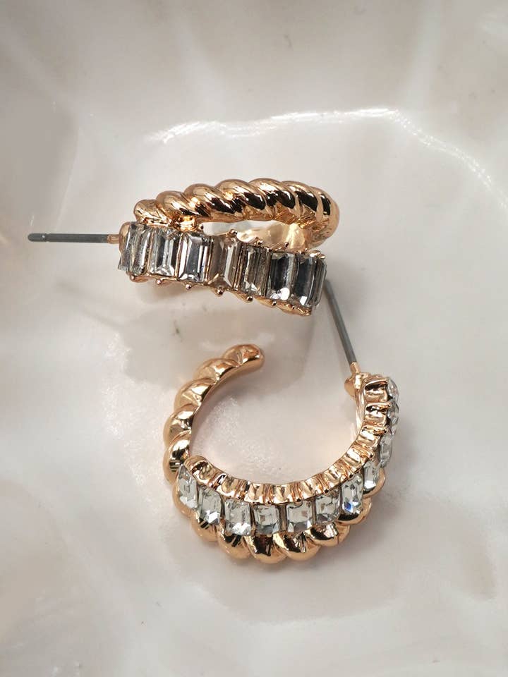 GOLD RHINESTONE INTWINED HUGGIE HOOP EARRINGS | 80E61000 for wholesale by JOSSLYN by wall to wall