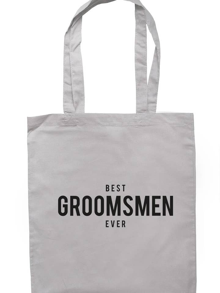 Bedste Groomsmen Nogensinde mulepose TB1275 for engroshandel hos Illustrated Identity