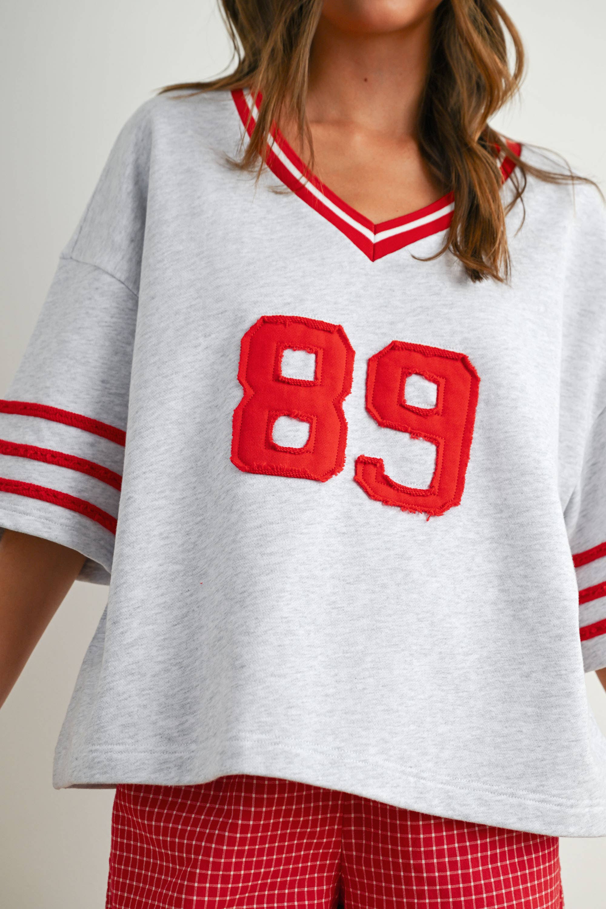 BUTTERMELON - Vendita all'ingrosso Maglietta - Donna - Maglia oversize sporty Varsity Spirit - BMT77343