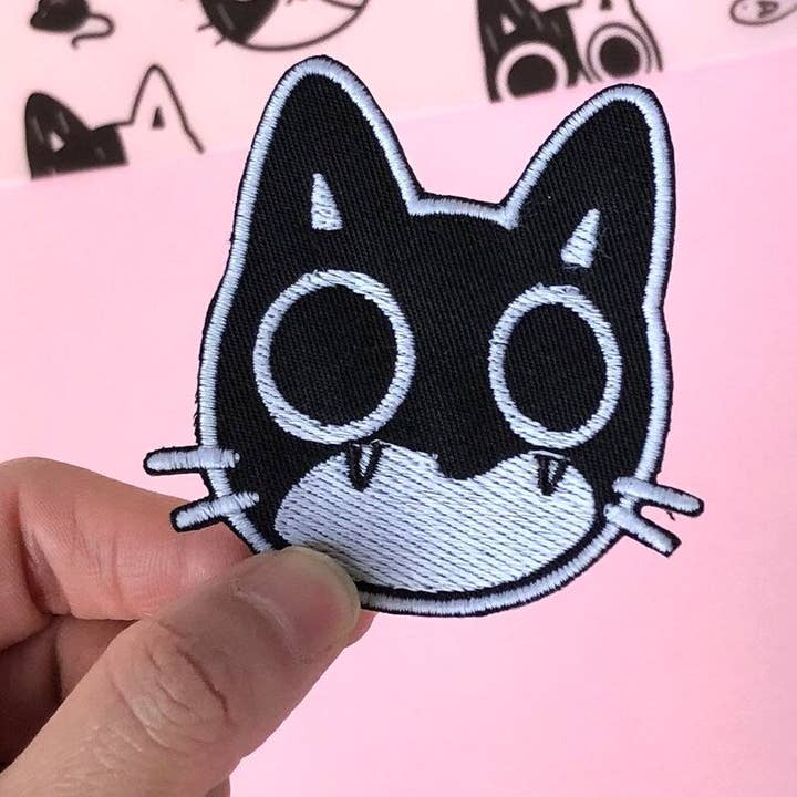 Glow In The Dark Surprised Cat Embroidered Iron On Patch for wholesale by Peachie Patches