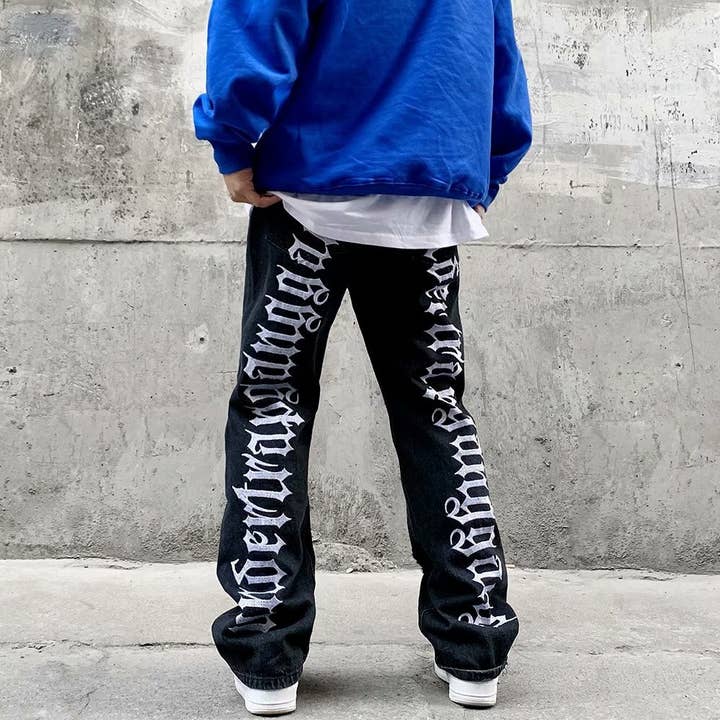 Black Men's hip-hop ripped jeans with letters embroidered for wholesale on Faire