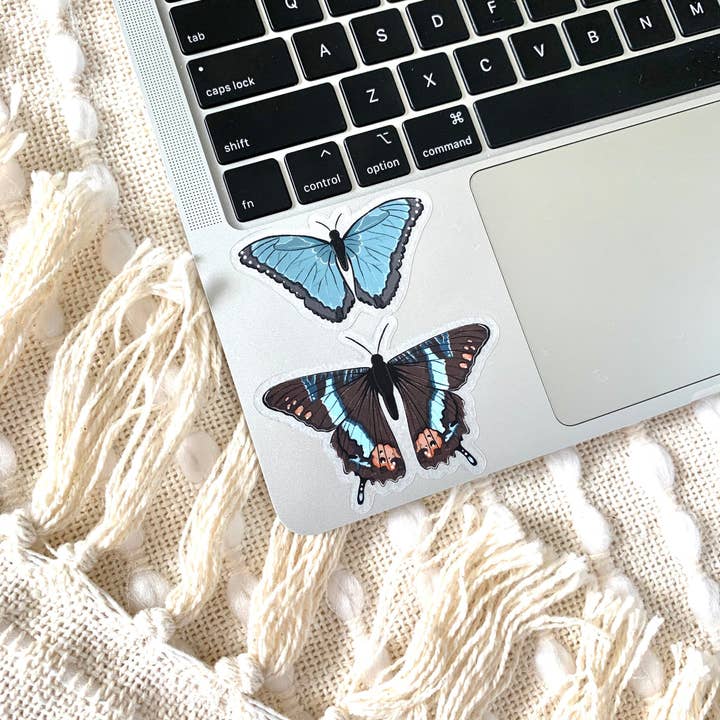 Elyse Breanne Design - Wholesale Sticker - Clear Common Blue Morpho Butterfly Sticker, 2.5x1.5in2