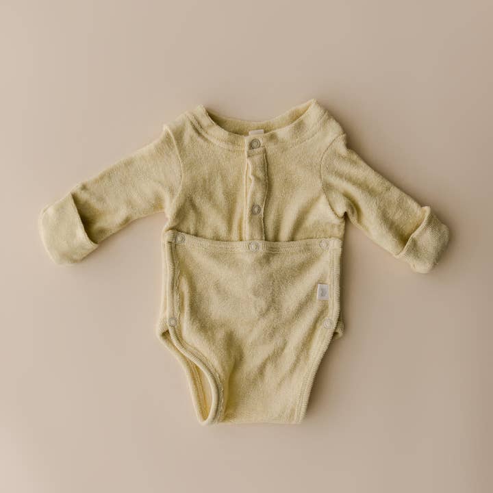 Terry Front flap Onesie | Buttercream for wholesale by August River Co.