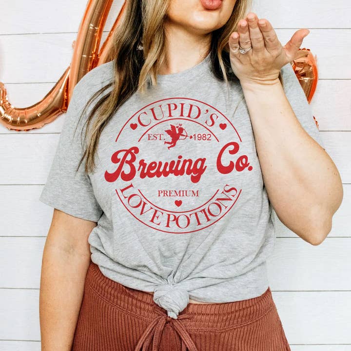 Cupid's Brew Co. - Valentine's Day Love Fun Gift T-Shirt and other Purchase Wholesale alternative brewing. Free Returns & Net 60 Terms on Faire trending on Faire.