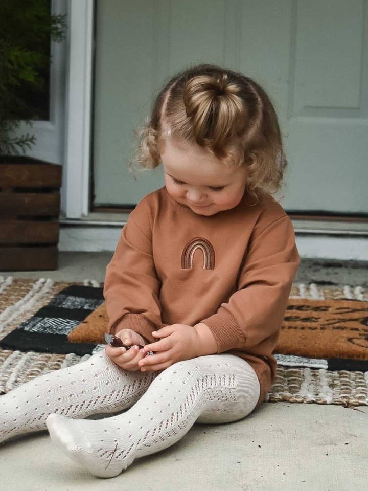 Regenbogen-Winterstrampler | Schokolade für den Großhandel von Wolfie Kids