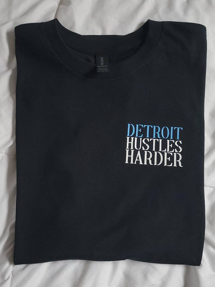 TheKingShirt - Wholesale Graphic Sweatshirt - Women's - Detroit Lions Hustle Harder Players Graphic Tee Shirt