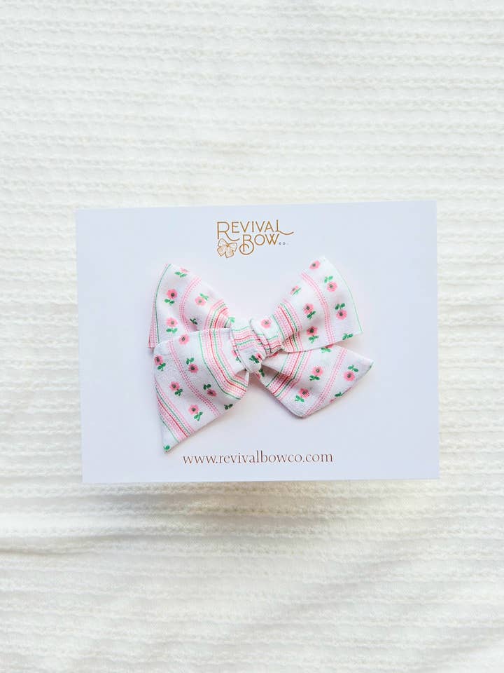 Small Handtied Bow on Clip / Pink Floral Stripe for wholesale by Revival Bow Co.