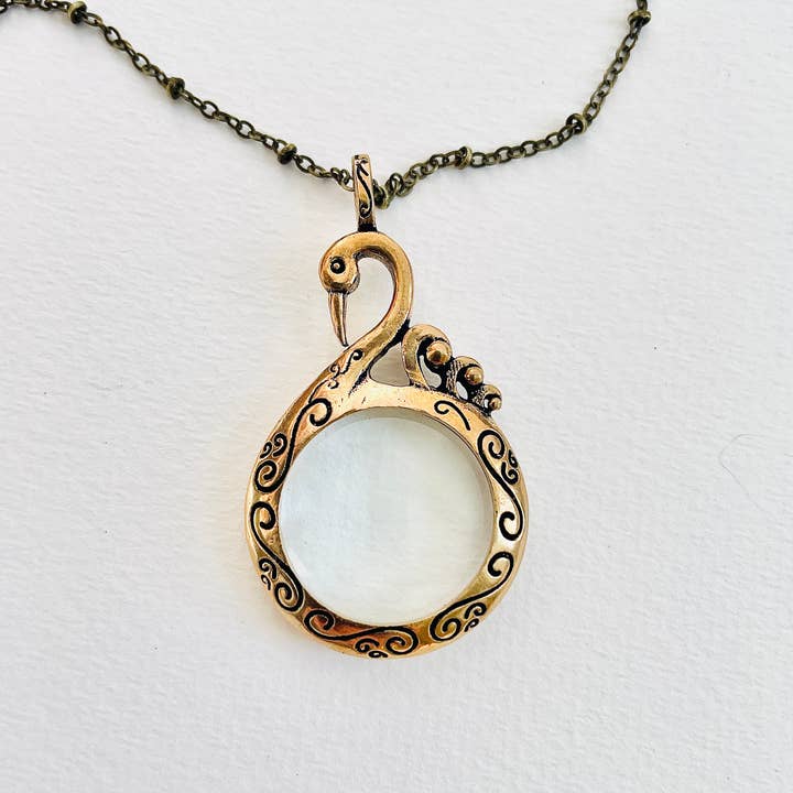 Swan Magnifying Glass Necklace -antique Gold Version for wholesale by SORA DESIGNS