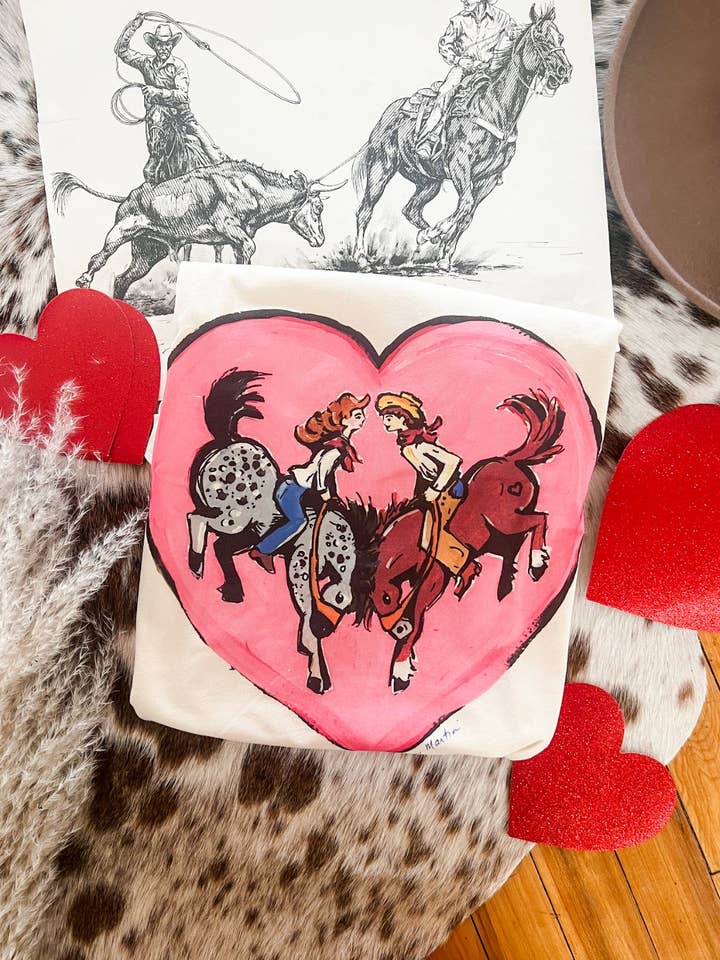 Kissing Buckers Valentines Cowboy Design Tee or Sweatshirt (cream) (Adult) for wholesale by Arrow F Apparel