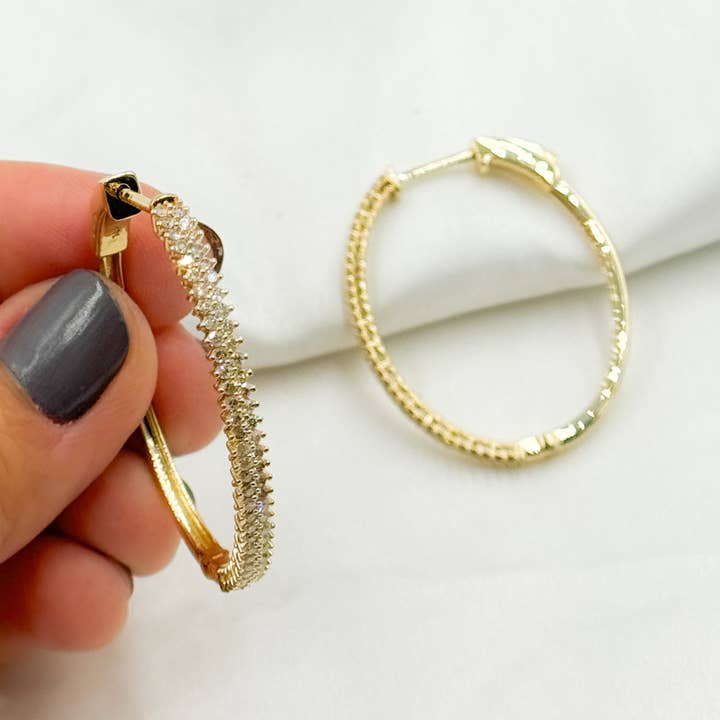 EHL56931. Créoles ovales en or massif 14k avec diamants pour la vente par Tresor Jewelry Inc.