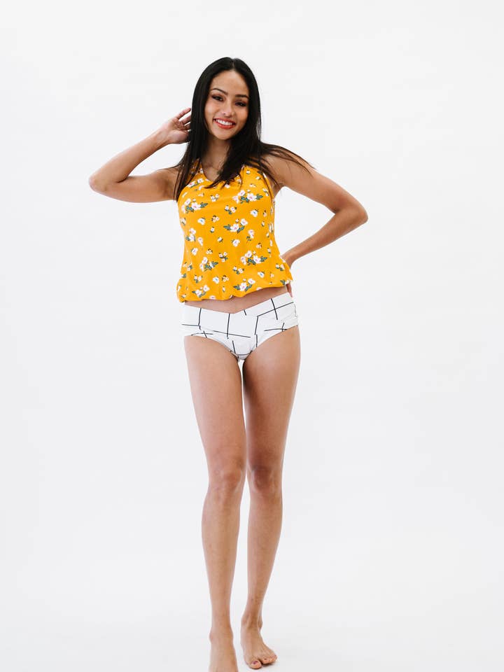 Camiseta tankini larga con estampado floral amarillo y dobladillo con bandas para venta al por mayor de Coral Reef Swim