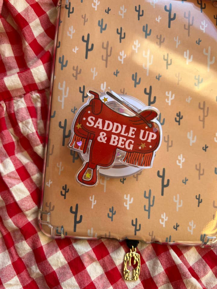 Súbete y suplica romance vaquero soporte para Kindle y teléfono para venta al por mayor de Sacred Hart Co