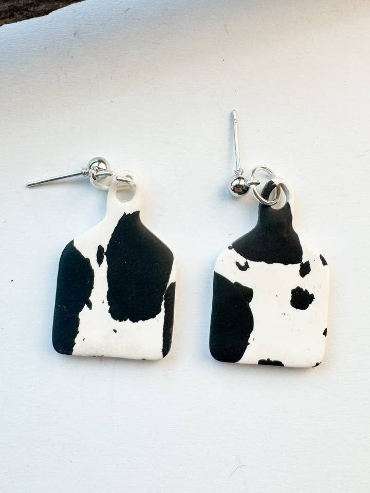 Cow Tag Earrings for wholesale by Mountain Made Clay - Handmade Polymer Clay Earrings