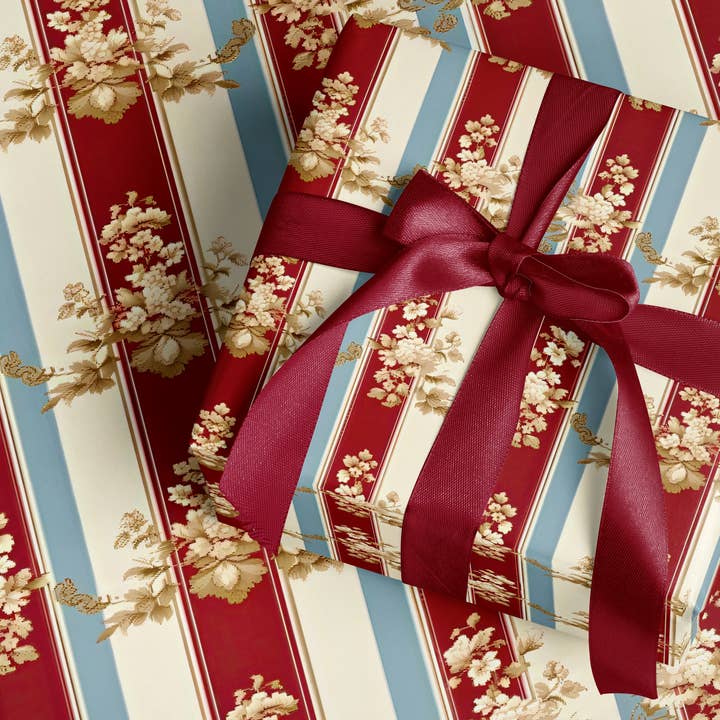 Stribet blomsterprint på rød og blå baggrund gavepapir for engroshandel hos MagicMerchEmporium