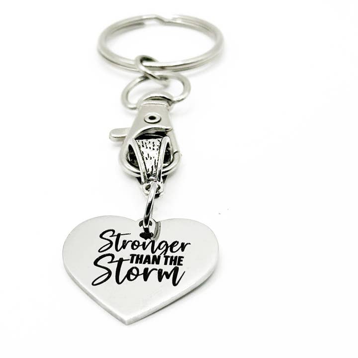 JKCE Designs - Wholesale Keychain – Unisex - Stronger Than The Storm Keychain Stainless Steel Engraved Heart Charm Inspirational Gift For Women Men Strength Quote Key Ring
