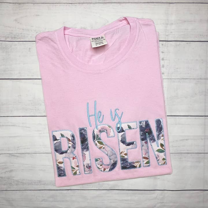 He is Risen Easter Applique Short Sleeve TShirt for wholesale by Handmade Pieces Company LLC