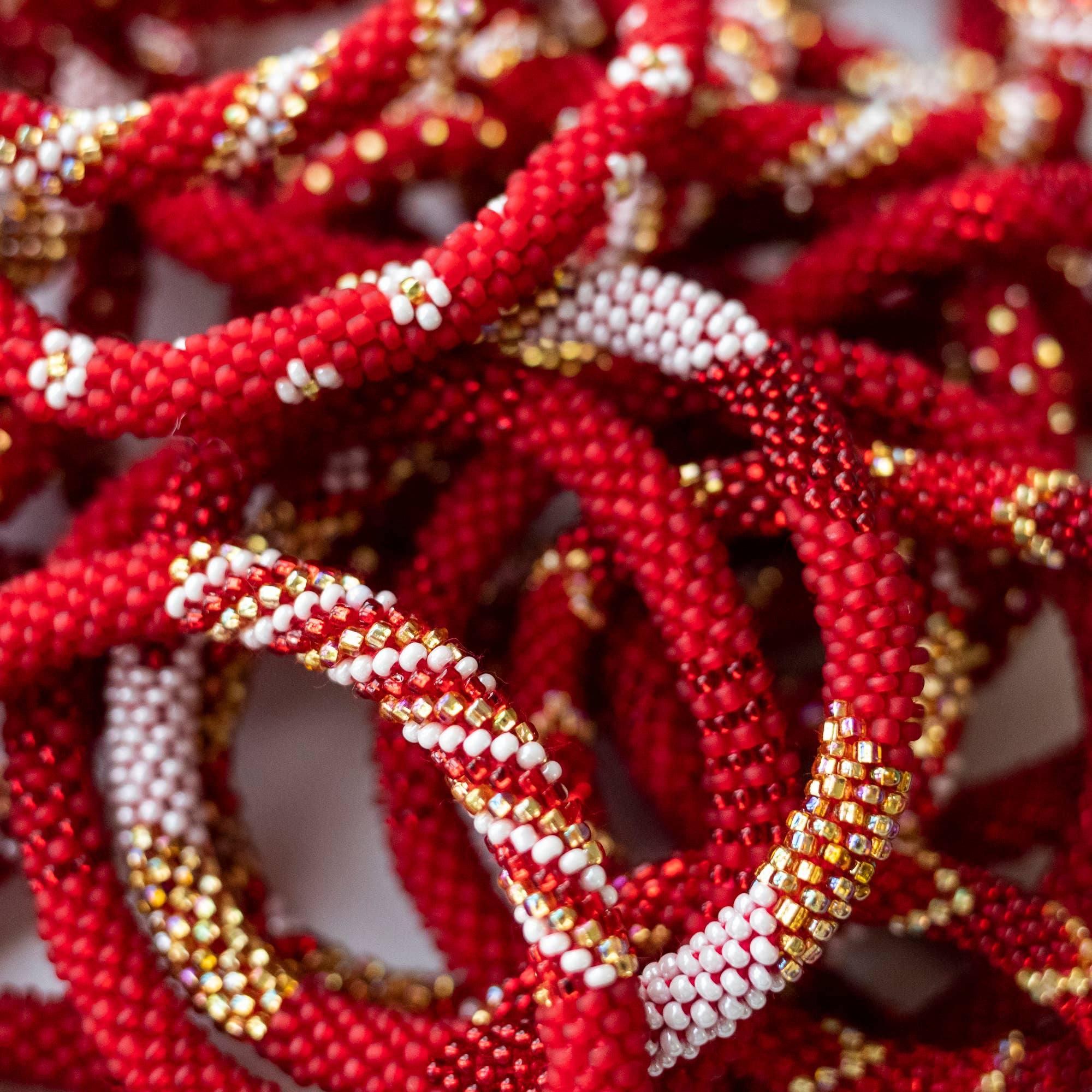 Aid Through Trade - Wholesale Jewelry Set - The Original Roll-On® Bracelet Cinnamon - Set of 122