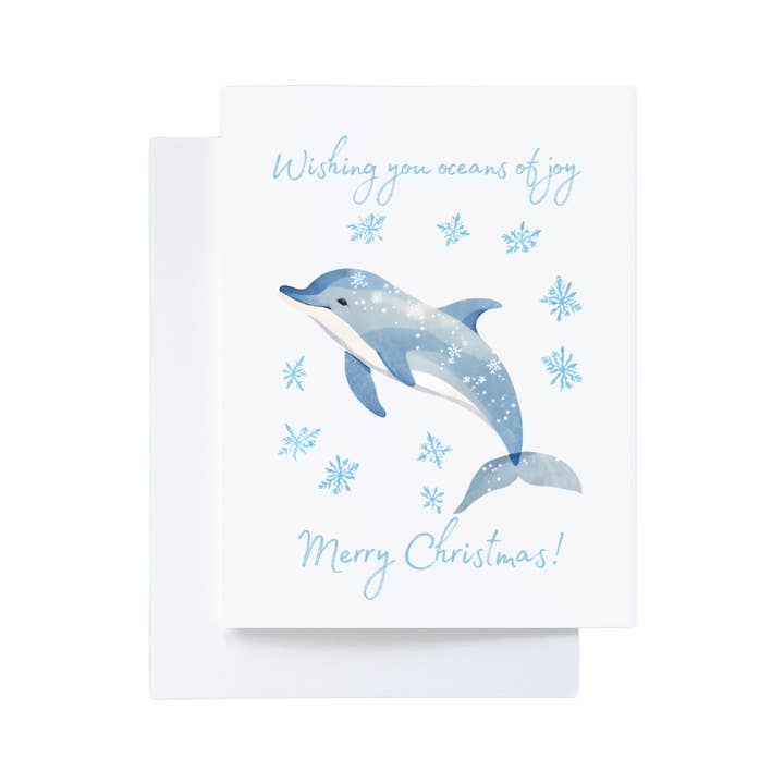 Delfin-Schneeflocken-Weihnachtskarte „Ich wünsche Ihnen Ozeane voller Freude“ für den Großhandel von Cryptic Paper Co.