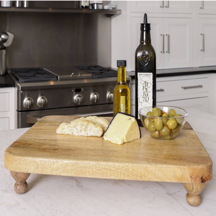 Artisan Wood 14x18x3 Natural Mango Wood Footed Serving Board for wholesale by Heritage Lace