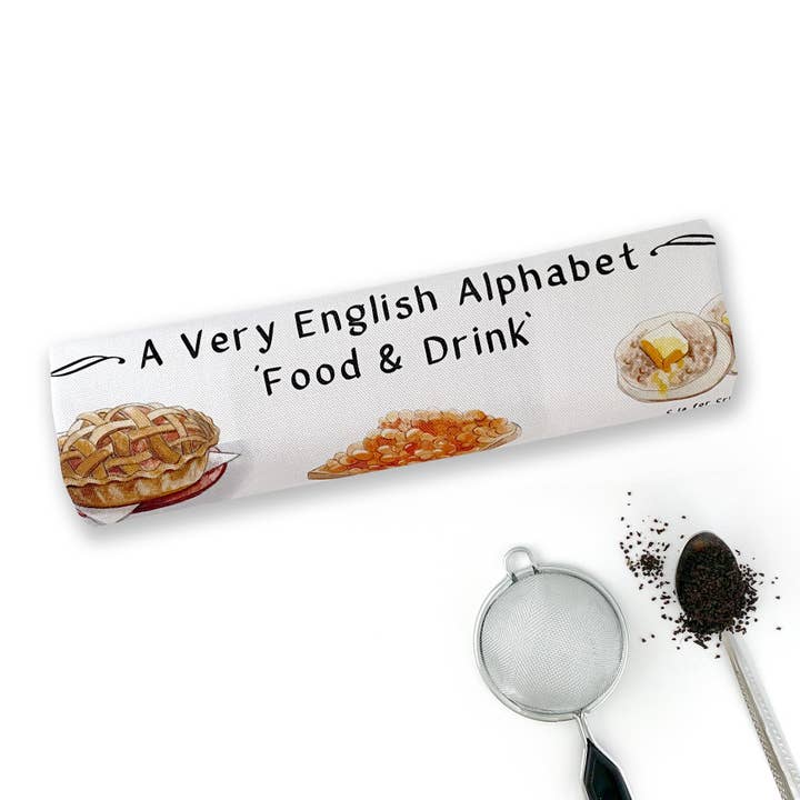 Un torchon « Food & Drink » en alphabet très anglais pour la vente par Yeti Cards & Gifts