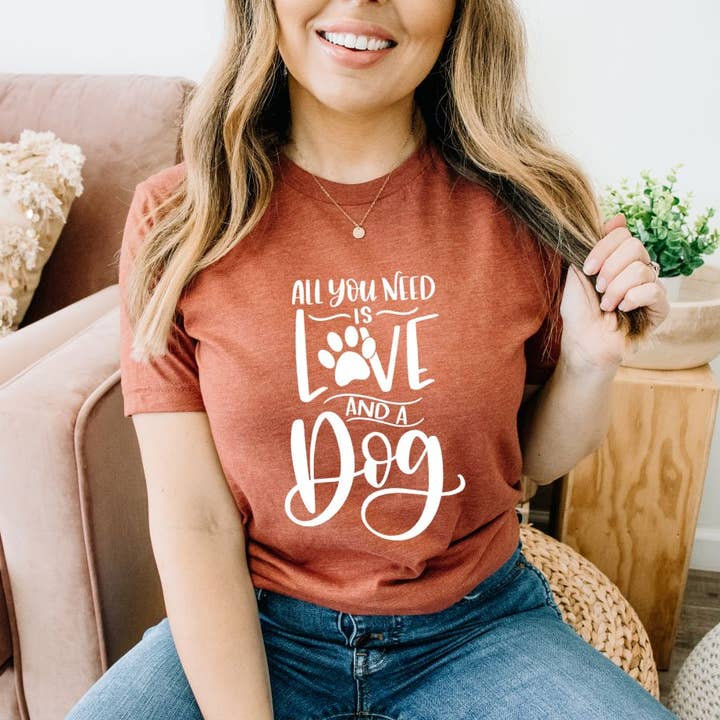 All You Need Is Love And A Dog T-shirt | Graphic Gifts for wholesale by KM Clothing