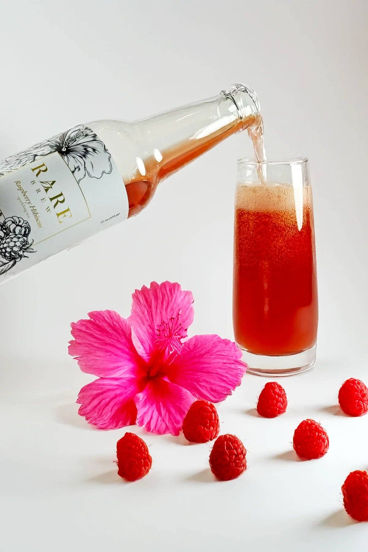 Rare Brew – Großhandel Alkoholfreier Aperitif/Mocktail – Raspberry Hibiscus - Sprudelnder Tee - Großhandelsflasche1