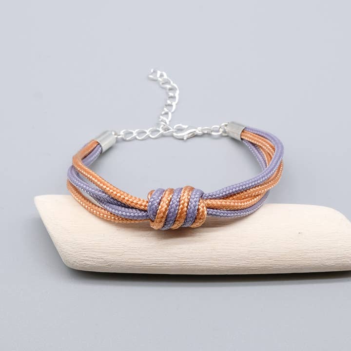 Paarse armband met spiraalknoop en perzik paracord voor wholesale door La Fabrique du Noeud