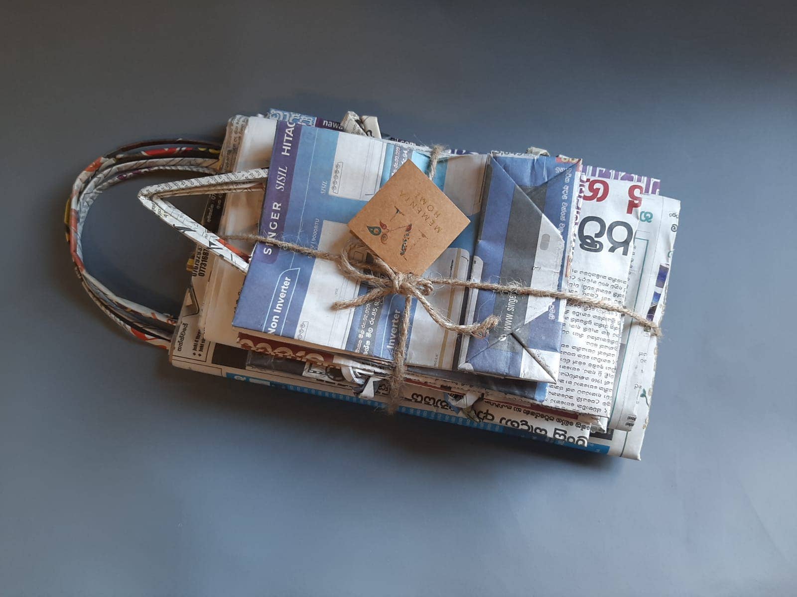 Wholesale Recycled Newspaper Gift Bags set of 8 for your store Faire