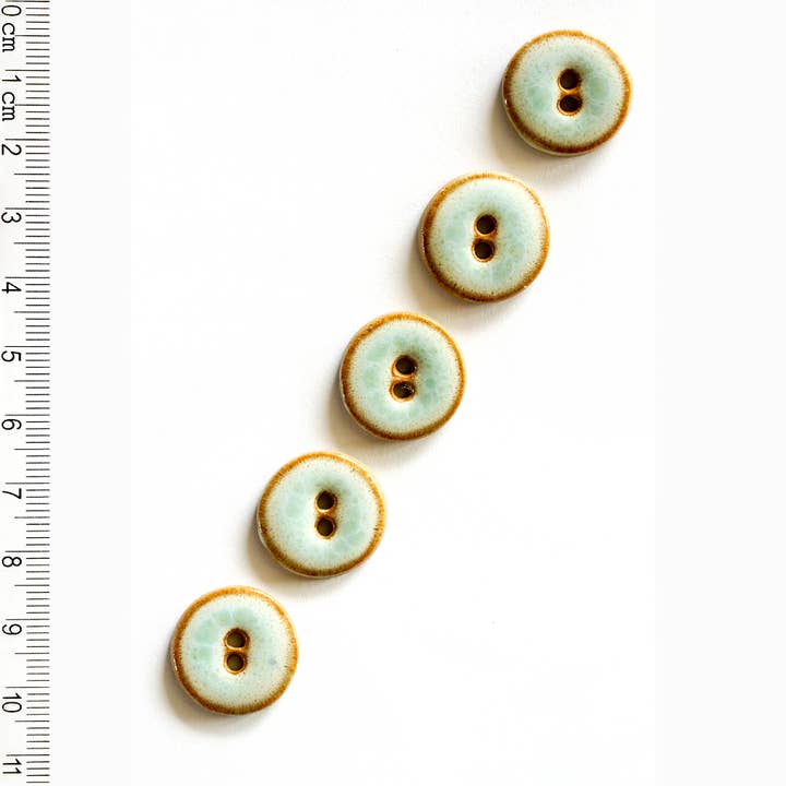 L359 Shiny Turquoise Buttons for wholesale by Incomparable Buttons