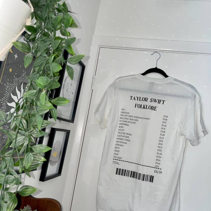 Maglietta Taylor Swift | Camicia folcloristica Taylor Swift | Maglietta album folcloristico | Maglietta album folcloristico di Taylor Swift per la vendita all'ingrosso da parte di WeareGMD