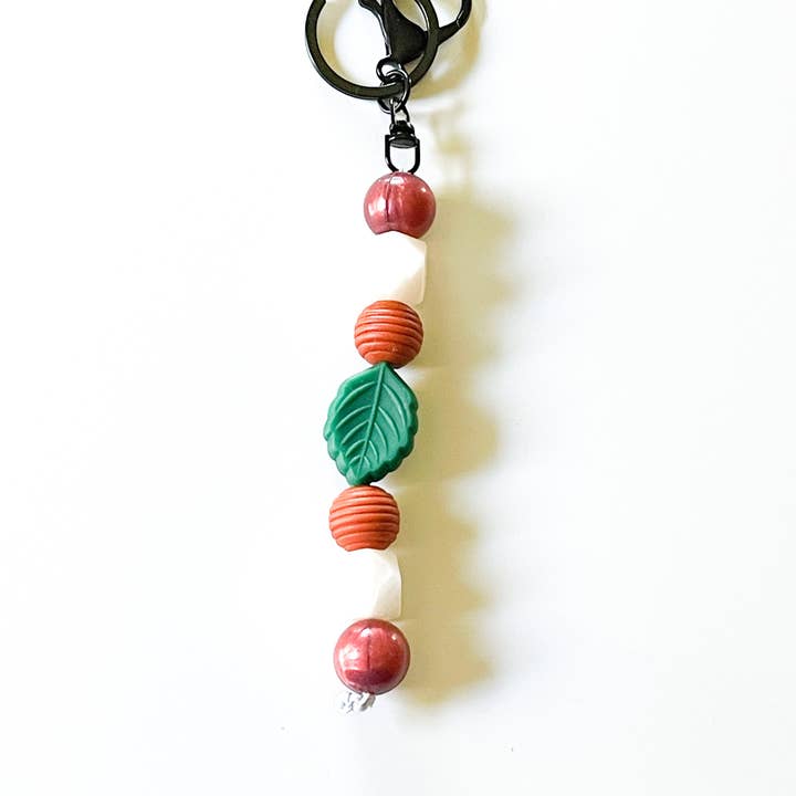 Portachiavi Fidget in betulla autunnale bordeaux per la vendita all'ingrosso da parte di Shop Simply Fidgets