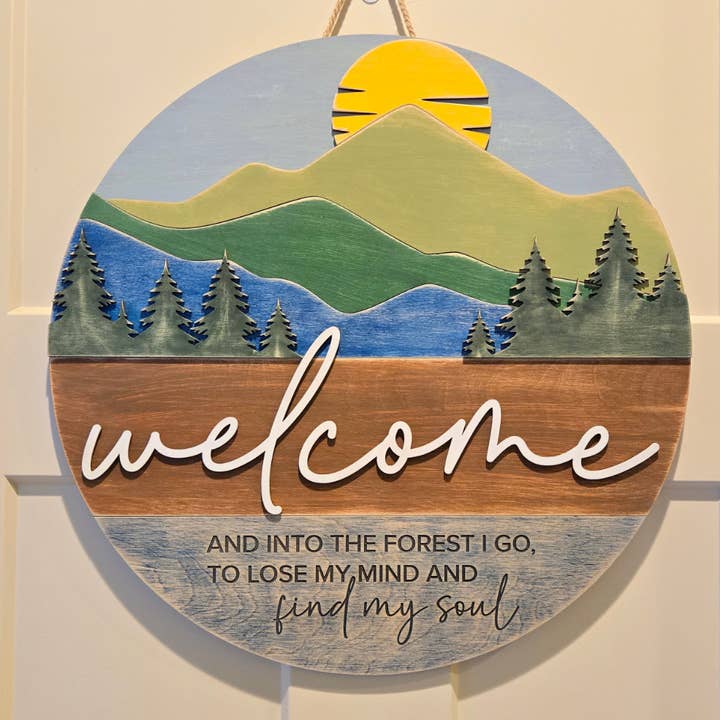 Into the Forest Welcome Round Sign 18" for wholesale by Black River Arts