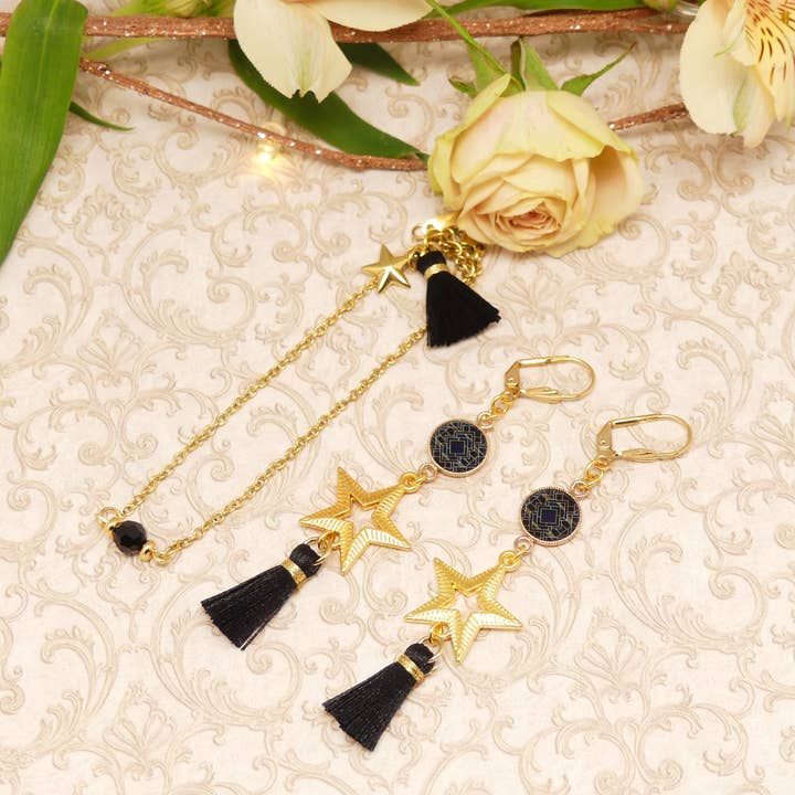 Set collana e orecchini a forma di stella con nappine in perle e resina per la vendita all'ingrosso da parte di Lydée Déco
