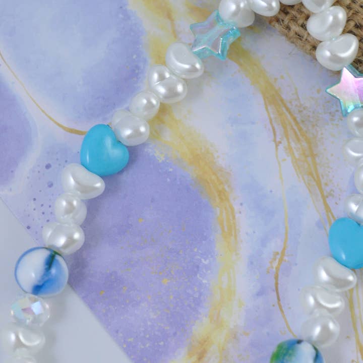 TheMellys - Vente Sangle pour étui à téléphone - Bracelet de téléphone en forme de cœur bleu nacré d'eau douce, chaîne de téléphone Y2K2