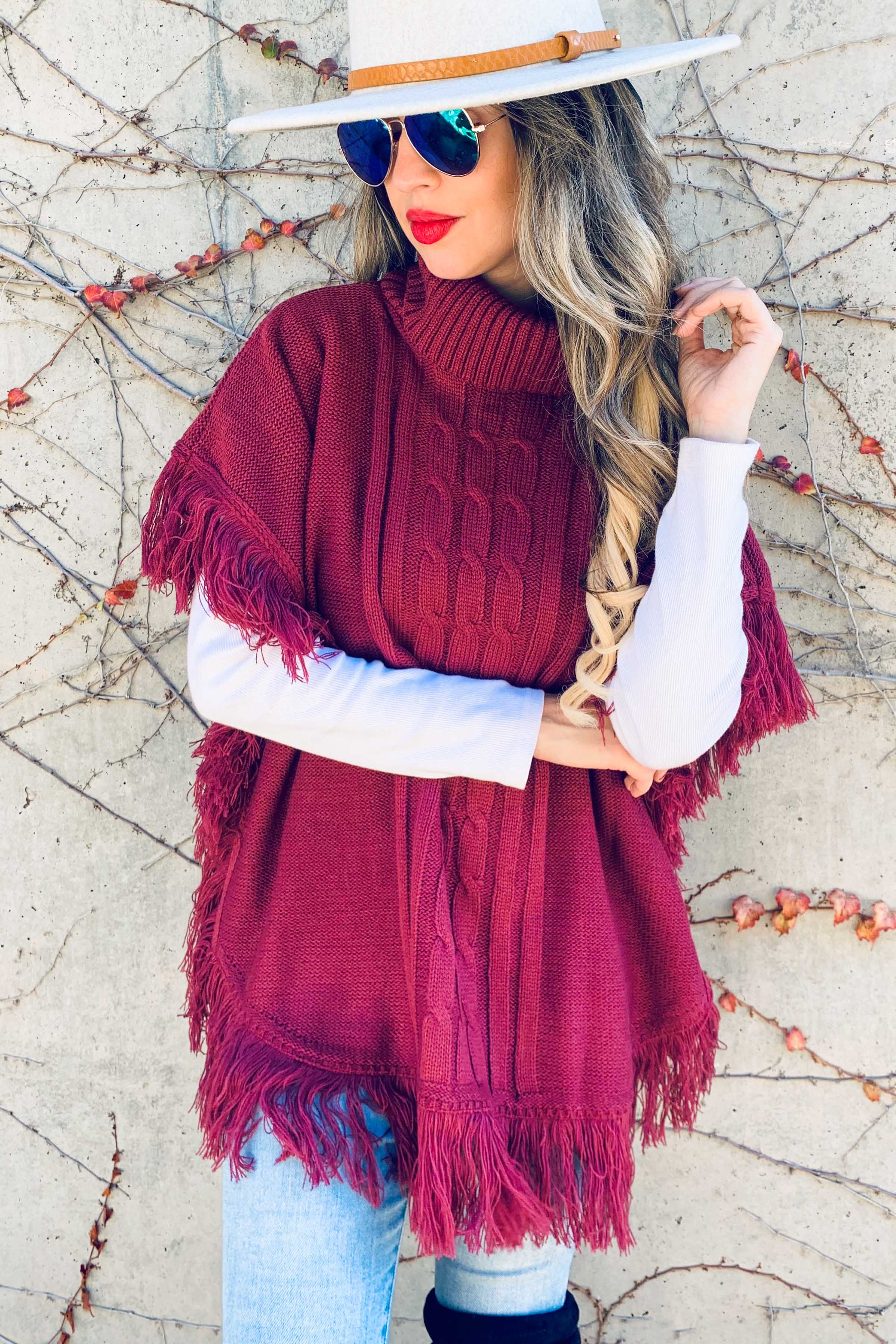 Berry Poncho a tunica in maglia a tunica con frange Berry in vendita all'ingrosso su Faire2