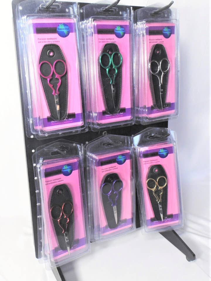 Display of 18 Needlepoint Scissors for wholesale by MAYA Cosmetics