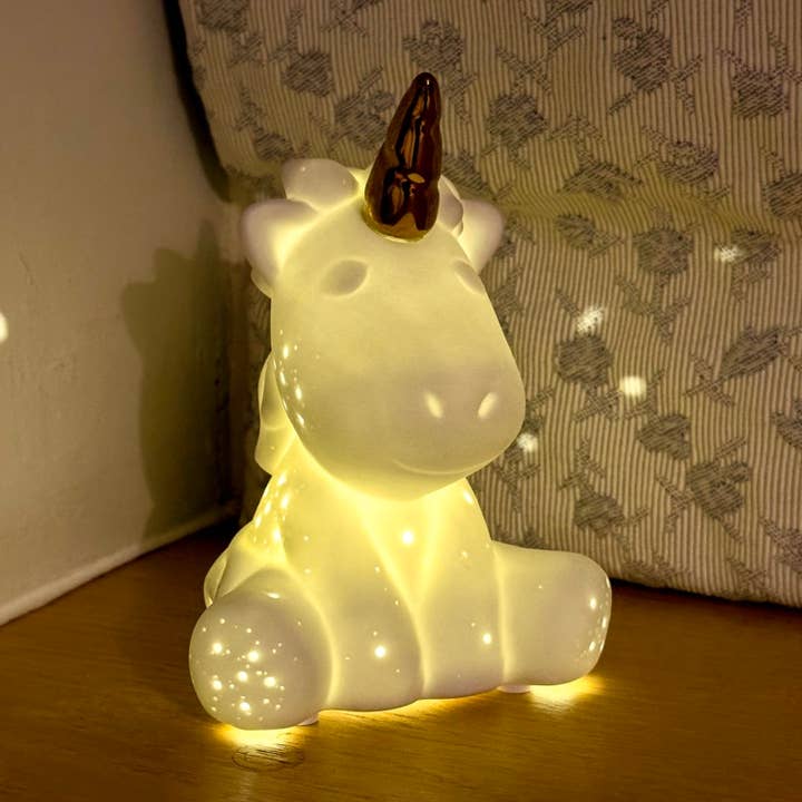 Small Porcelain LED Table Lamp in a Unicorn design for wholesale by L. GLOW Home