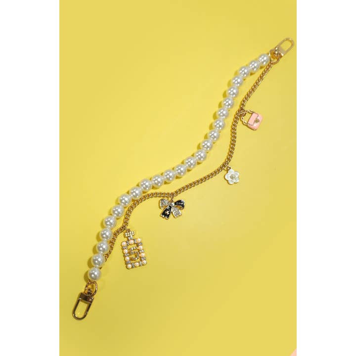 Gold CHAIN BAG CHARM-PEARL CHAIN BOW FLOWER PURSE | 40KC123 for wholesale on Faire