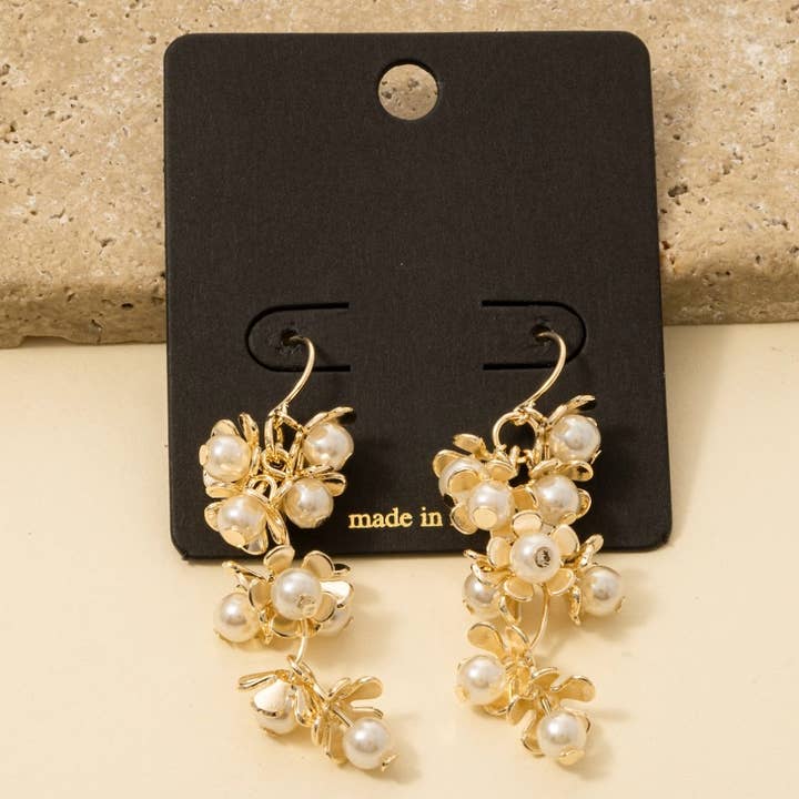 G Pearl Flower Cluster Chain Dangle Earrings for wholesale on Faire