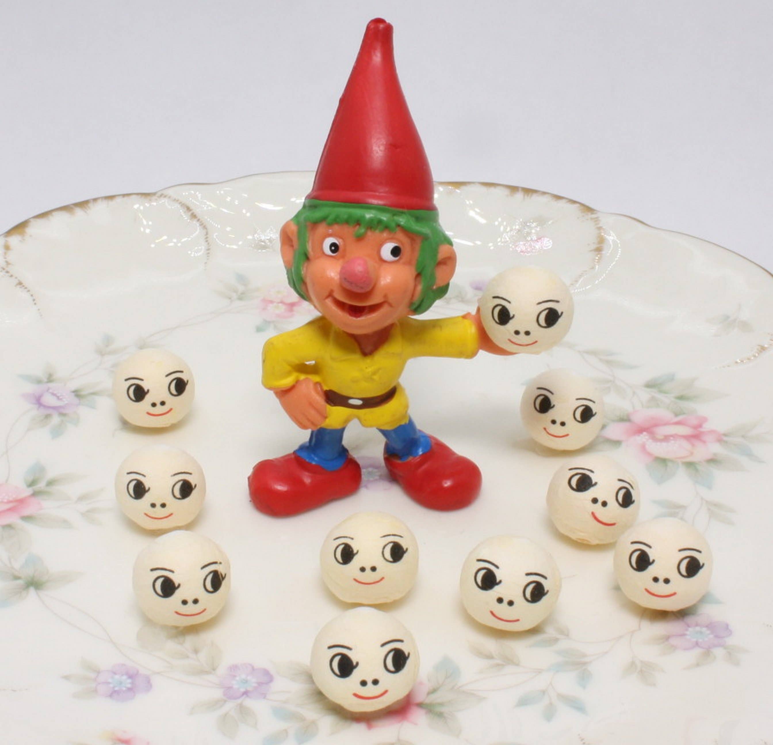 Doll Heads - 1/2" Spun Cotton with Faces - Set of 10 for wholesale on Faire4