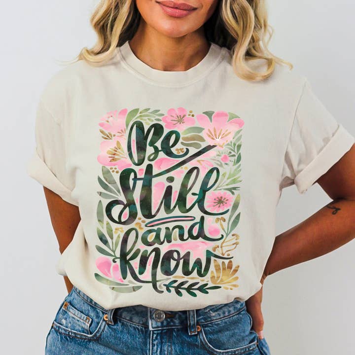Be Still and Know Pink Floral Comfort Color Christian Tshirt for wholesale by Scripted Pearl